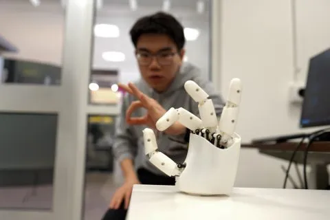 Wristband Enables Wearers to Control a Robotic Hand